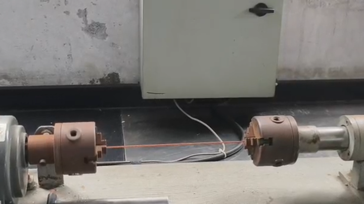 CCS conductor secured in torsion test grips