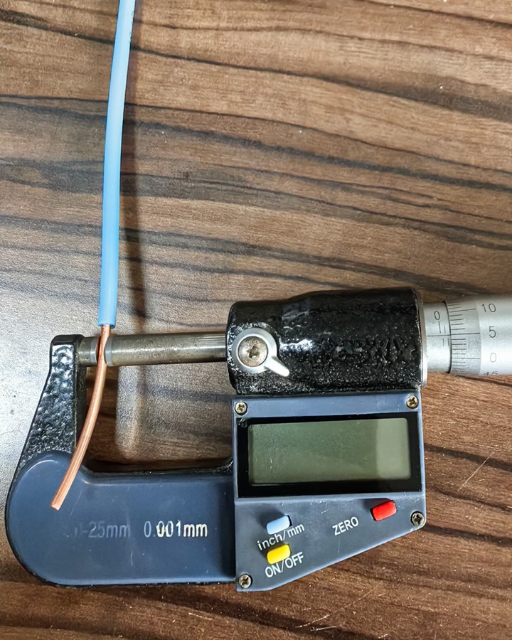 Micrometer measuring the exposed CCS conductor diameter